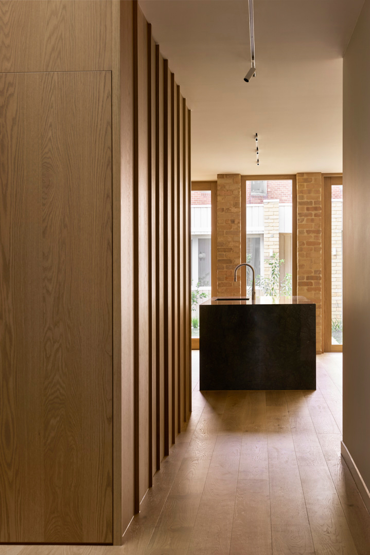 Timber batten joinery and kitchen island in a Fitzroy Passivhaus home