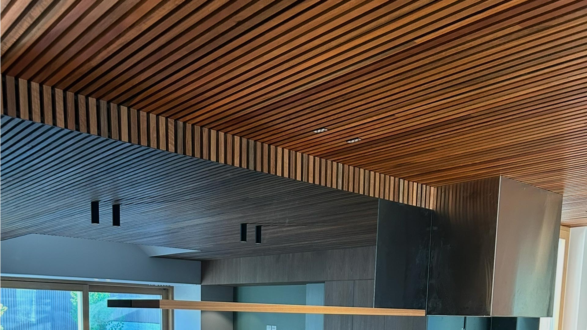 Kitchen with timber batten ceiling and biophilic detailing in a Melbourne high-performance retrofit